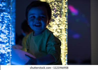 Young Kid Exploring A Multi Sensory Space - Snoezelen Concept