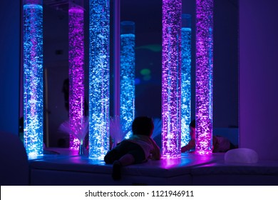 Young Kid Exploring A Multi Sensory Space - Snoezelen Concept