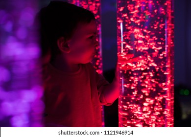 Young Kid Exploring A Multi Sensory Space - Snoezelen Concept