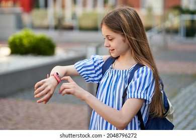 Young Kid Girl Make Video Call Her Parents With Her Pink Smartwatch.near School.