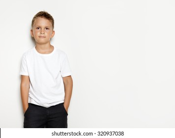 Young Kid Wearing Black Shorts And White Tshirt