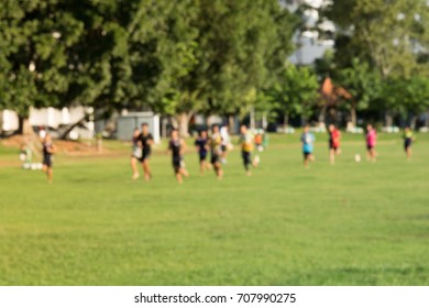 Young Kids Playing A Soccer Training Match Field.