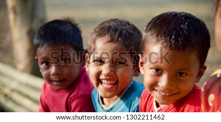 Young kids smiling together sitting in a place