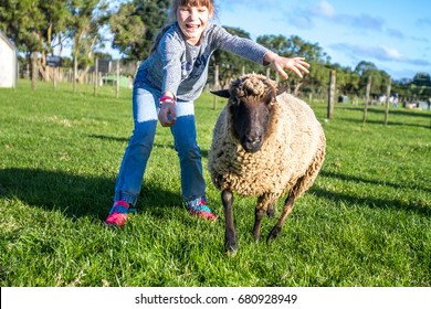 Young Kids Taking Care Of Animals On A Farm