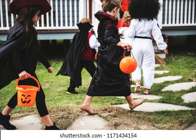 Young Kids Trick Or Treating During Halloween