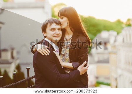 Young kissing happy couple in love