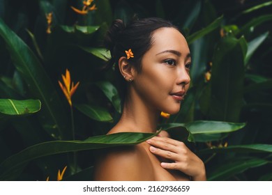 Young Korean woman with healthy skin and body looking away during dayspa weekend at nature, beautiful female girl with brunette hair relaxing and resting during recreation pastime at treatment