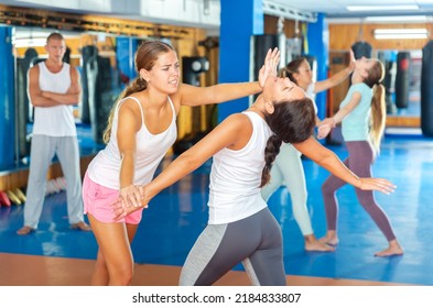 Young Lady Doing Heel Palm Chin Strike During Group Self-defence Training.