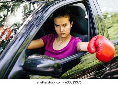 Young Lady Driver Seems To Be Nervous And She Is Wearing A Box Glove While Sitting In The Car.