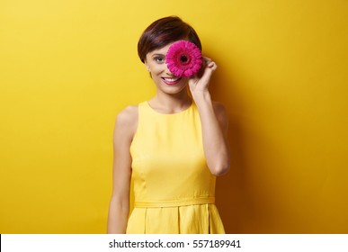 Young Lady With Flower In Front Of Eye