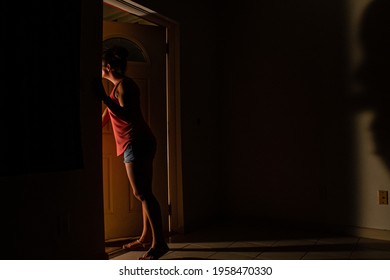 A Young Lady Has Had Enough Of Quarantine And Is About To Breach Her Obligation By Running To The Outside World Through The Front Door To Her Apartment