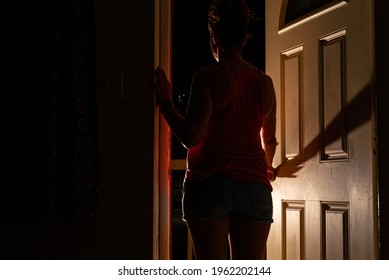 A Young Lady Has Had Enough Of Quarantine And Is About To Breach Her Obligation By Running To The Outside World Through The Front Door To Her Apartment