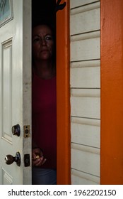 A Young Lady Has Had Enough Of Quarantine And Is About To Breach Her Obligation By Running To The Outside World Through The Front Door To Her Apartment