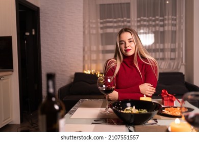 Young Lady Lonely Having Dinner At Home With Wine, Dating Online Valentine's Day, Woman With Wine Glass Alone At Table With Food And Alcohol, Lonely Holiday Concept