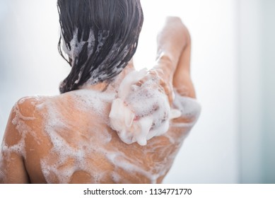 Young Lady With Smooth Skin Taking Shower With Flavorous Gel While Turning Back To Camera