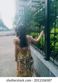 A Young Lady Standing Alone.