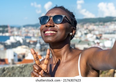 young lady taking a selfie on a hot day - Shutterstock ID 2176307623