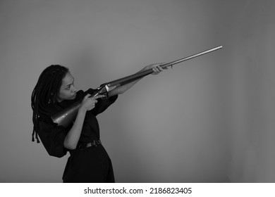 Young Lady With A Vintage Shotgun