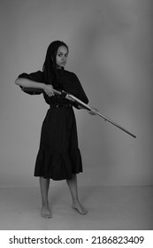 Young Lady With A Vintage Shotgun