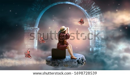 Young lady woman in retro dress and hat sitting on suitcase and flies on ammonite fossil through space and universe, idyllic fantasy scene with ghost arch ruins and butterflies, travel around world.