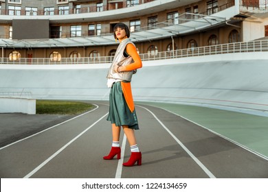 Young Languid Girlfriend. Atypical Attractive Woman Showing Her Unusual Outfit While Fashion Photoshoot