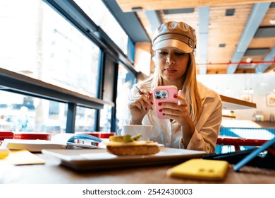 Young Latin businesswoman using dual phones to stay connected - Powered by Shutterstock