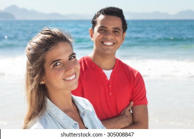 Young latin couple at beach