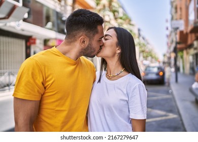 Young Latin Couple Kissing And Hugging At The City.