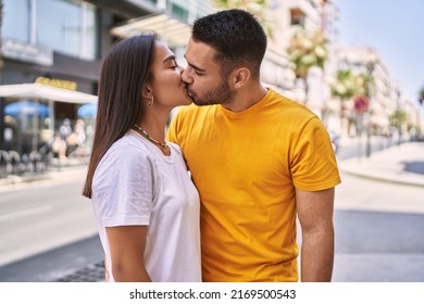 Young Latin Couple Kissing And Hugging At The City.