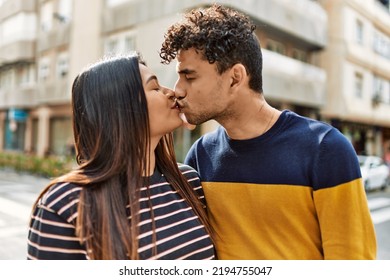 Young Latin Couple Kissing And Hugging At The City.