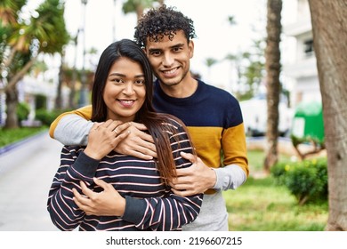 Young Latin Couple Smiling Happy And Hugging At The City.