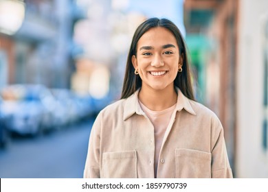 Young Latin Girl Smiling Happy Standing At The City.
