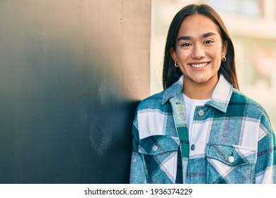 Young Latin Girl Smiling Happy Standing At The City.