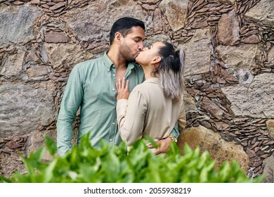 Young Latin Male And Female Couple In Love Kissing Between 25 And 35 Years Old