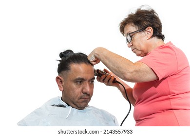 Young Latin Man Getting A Haircut At Home By An Older Woman With Freckled Skin