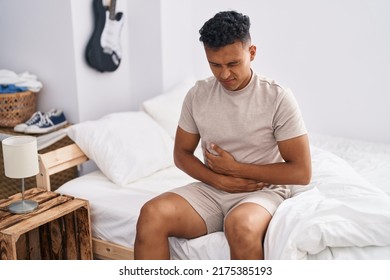 Young Latin Man Suffering For Stomach Flu At Bedroom