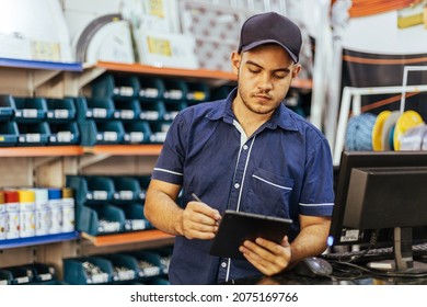 Young Latin Man Working In Hardware Store