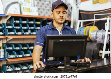 Young Latin Man Working In Hardware Store