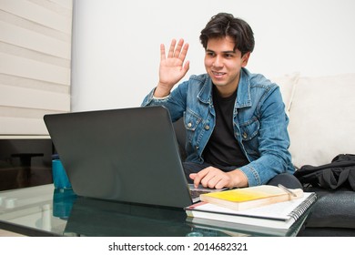 Young Latin Student Taking A Virtual Class On His Laptop