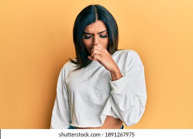 Young Latin Transsexual Transgender Woman Wearing Casual Clothes Feeling Unwell And Coughing As Symptom For Cold Or Bronchitis. Health Care Concept. 