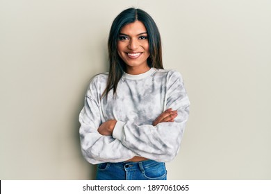 Young latin transsexual transgender woman wearing casual clothes happy face smiling with crossed arms looking at the camera. positive person. 