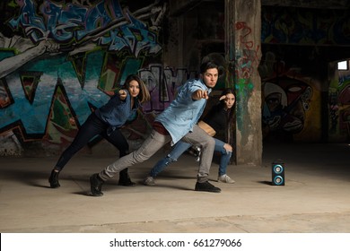 Young Latin Urban Dancers Showing Some Of Their Dance Moves While Practicing A Routine