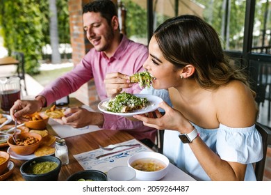 young latin woman eating mexican tacos on a restaurant terrace in Mexico Latin America, feeling happy on a summer day - Shutterstock ID 2059264487