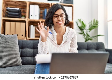 Young Latin Woman Having Psychology Online Session Using Laptop At Psychology Center