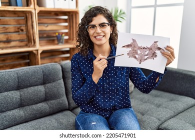 Young Latin Woman Having Psychology Session Doing Rorscharch Test At Psychology Center