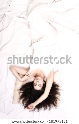 Similar – a girl with her hair by her face lying on the bed