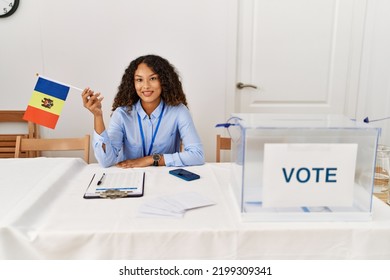 Young Latin Woman Smiling Confident Holding Moldova Flag Working At Electoral College