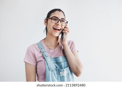 Young Latin Woman Student Calling By Phone On Gray Background In Latin America