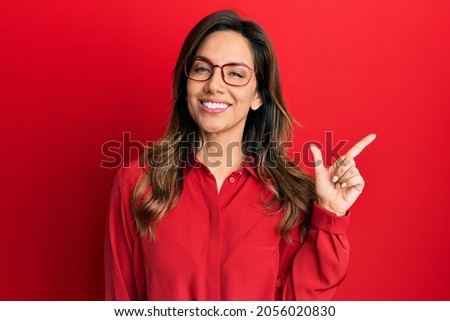 Similar – Image, Stock Photo Woman with a red coat behind a white column, heavily overexposed.