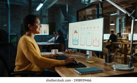 Young Latina Designer Working on a Desktop Computer in Creative Office. Beautiful Diverse Multiethnic Female is Developing a New App Design and User Interface in a Digital Graphics Editing Software. - Shutterstock ID 1908939466